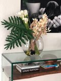 Moon vase with cymbidiums and callas