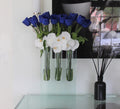 Triple bud vase with blue tulips